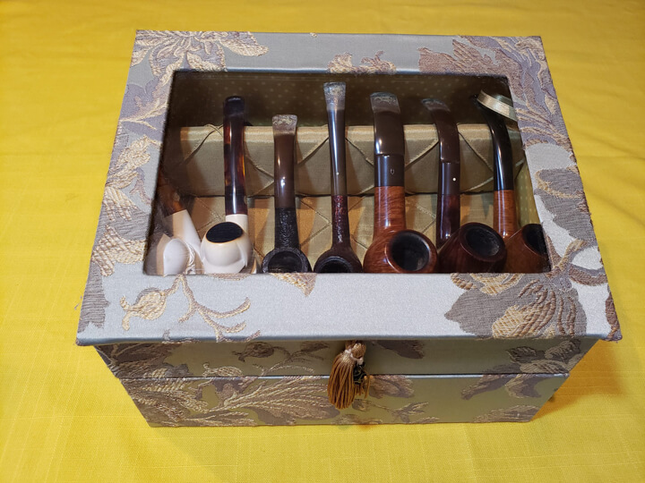Pipe collection in a special handmade Japanese-style case belonging to a Japanese Sherlock Holmes fan, Hiroshi Minemura. A senior publishing executive at a major international publisher who as a child was determined to learn and master English with the aim of reading the original Sherlock Holmes tales, he enjoyed reading so much in Japanese, in English. A decision that changed his life and took him on his own international publishing adventures in London, San Francisco, Brussels and Amsterdam. Photograph: Hiroshi Minemura 